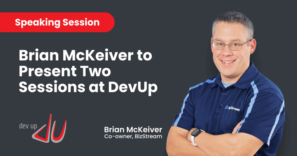 An image featuring Brian McKeiver, co-owner of BizStream, with text indicating his participation at the DevUp Conference. The text reads: "Speaking Session - Brian McKeiver to Present Two Sessions at DevUp." Brian is smiling, wearing a blue BizStream polo shirt, and stands with his arms crossed. The DevUp logo is displayed at the bottom left.
